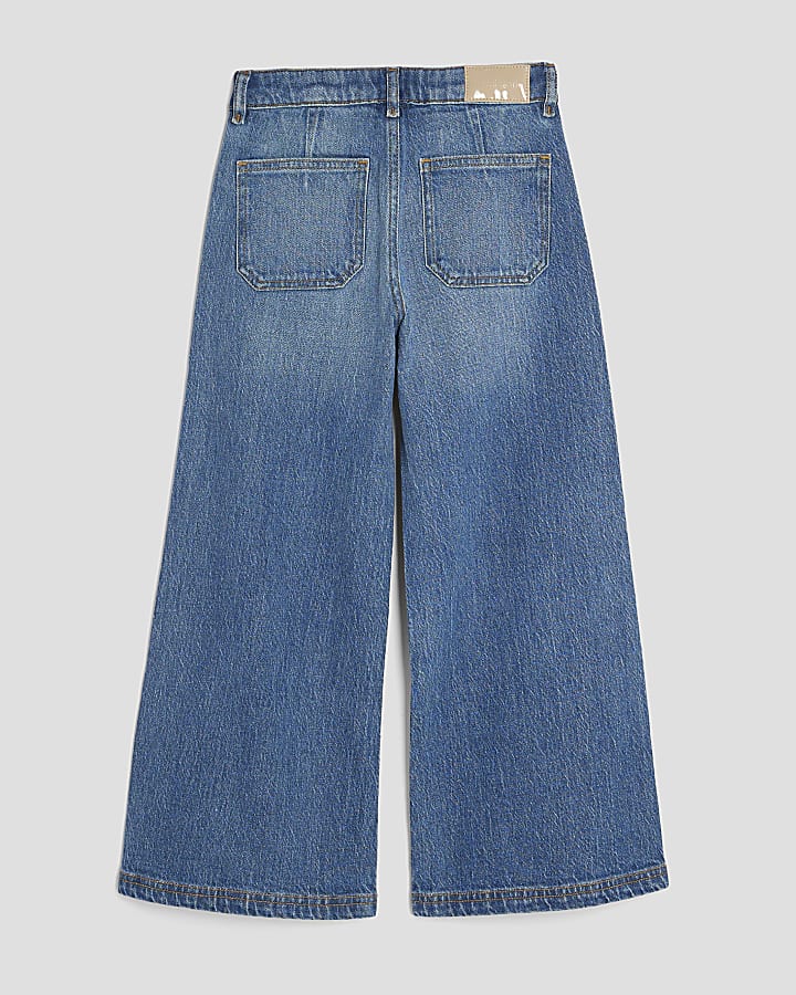 ragazze in gamba larga tasca anteriore dei jeans