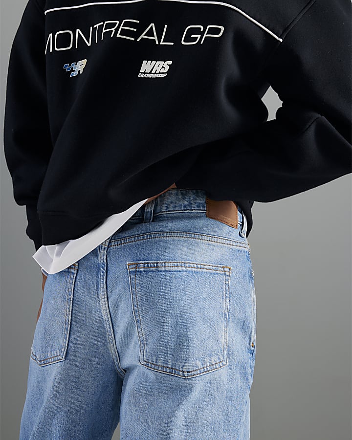 blu denim gamba a tubo mid wash jeans