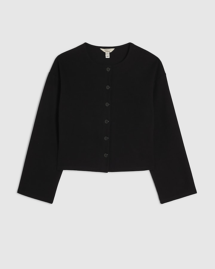nero accogliente pulsante attraverso cardigan