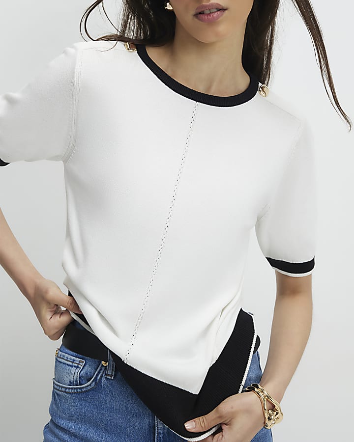 crema a maglia con punta in alto