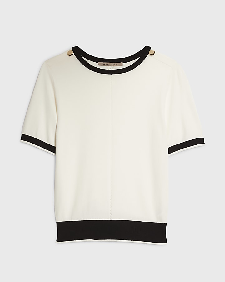 crema a maglia con punta in alto