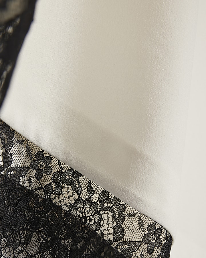 crema manica corta in pizzo asimmetrica top