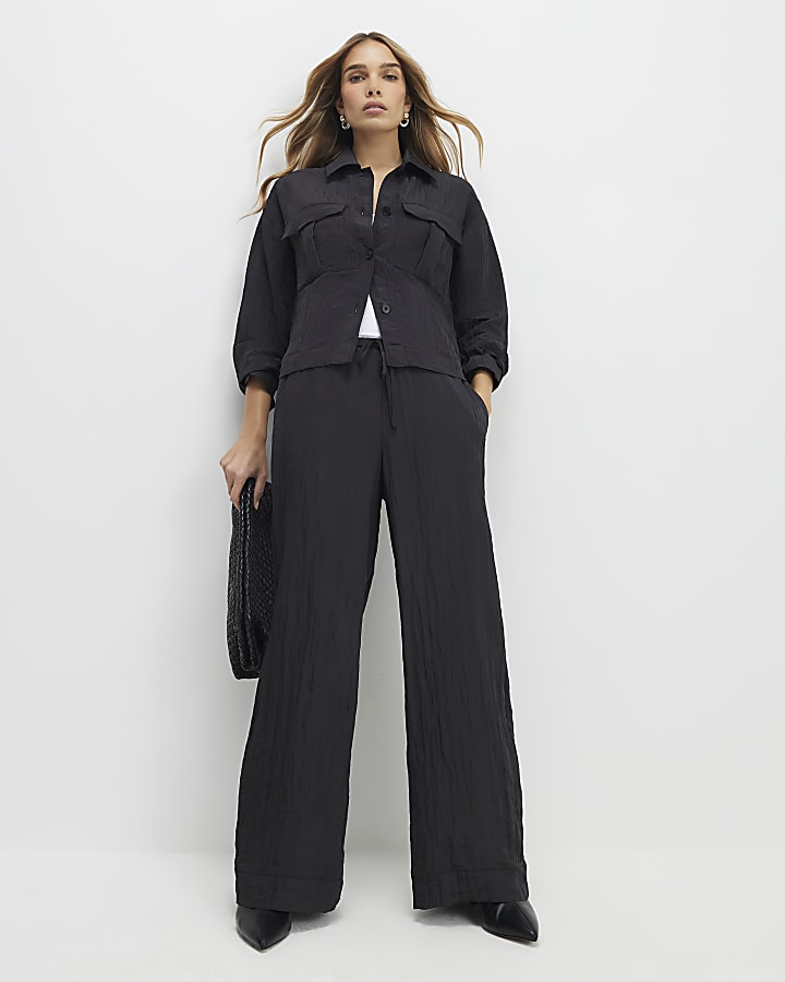 nero con texture di gamba dritta pantaloni