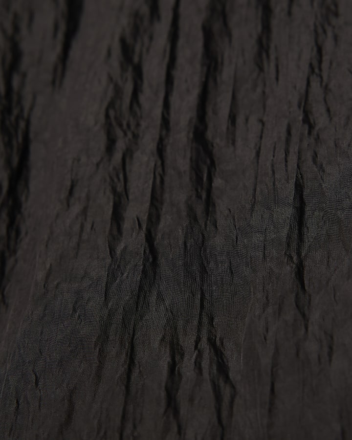 nero con texture di gamba dritta pantaloni