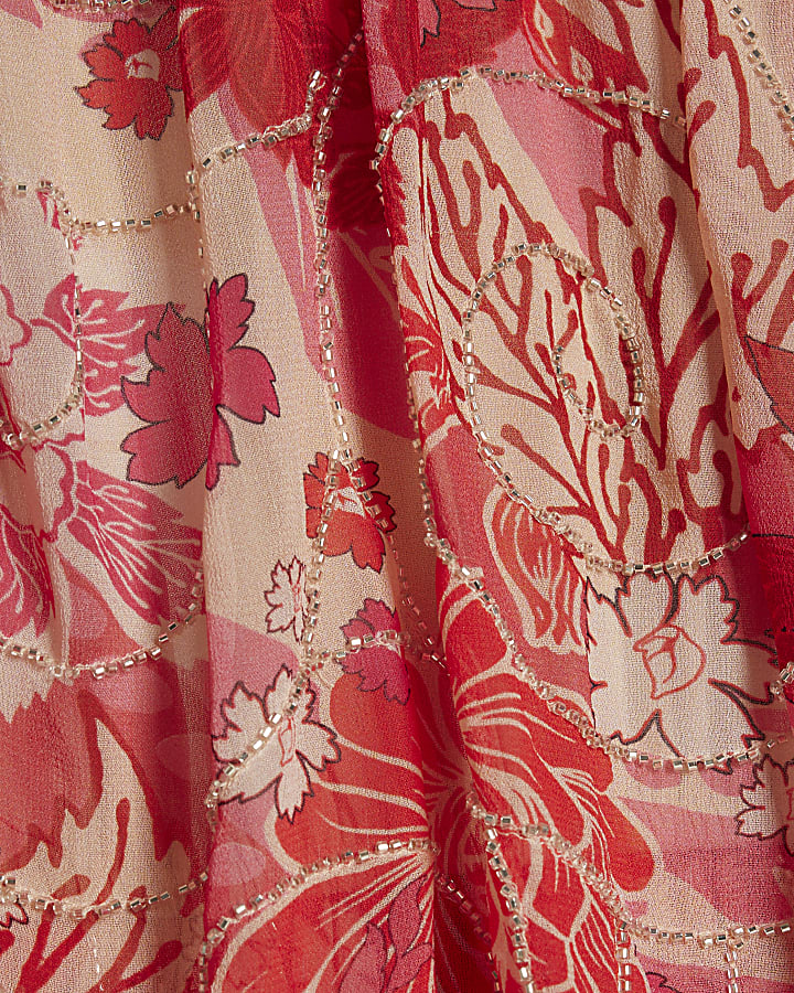 rosso floreale impreziosito tutina